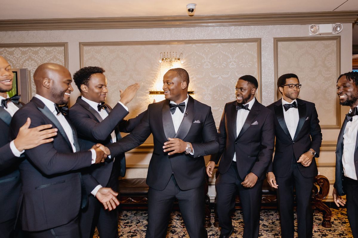 The crew laughing together in the hallway